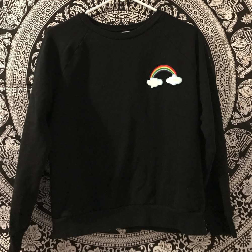 Black sweater with rainbow patch